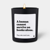 Duftkerze Schwarz Woody A human cannot survive on books alone. They also need cats. von ChattyCandles