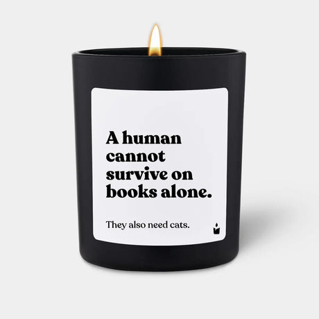 Duftkerze Schwarz Woody A human cannot survive on books alone. They also need cats. von ChattyCandles
