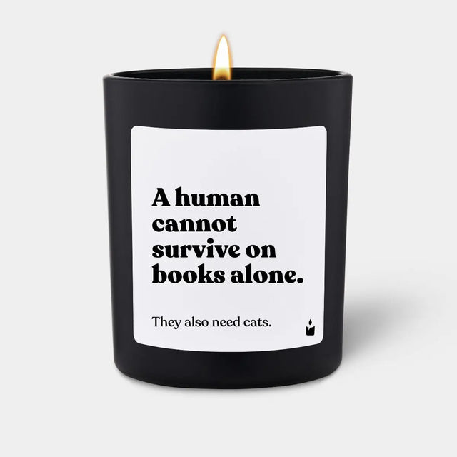 Duftkerze Schwarz Woody A human cannot survive on books alone. They also need cats. von ChattyCandles